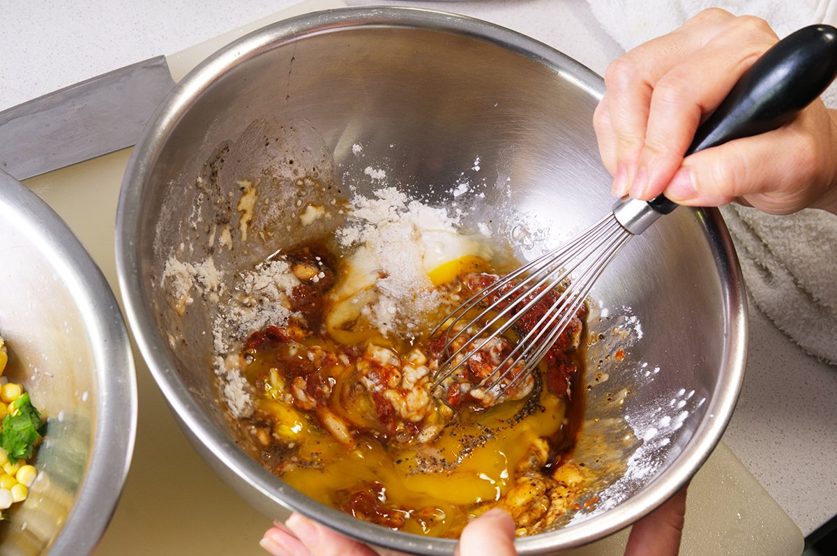 mixing the batter for corn fritters