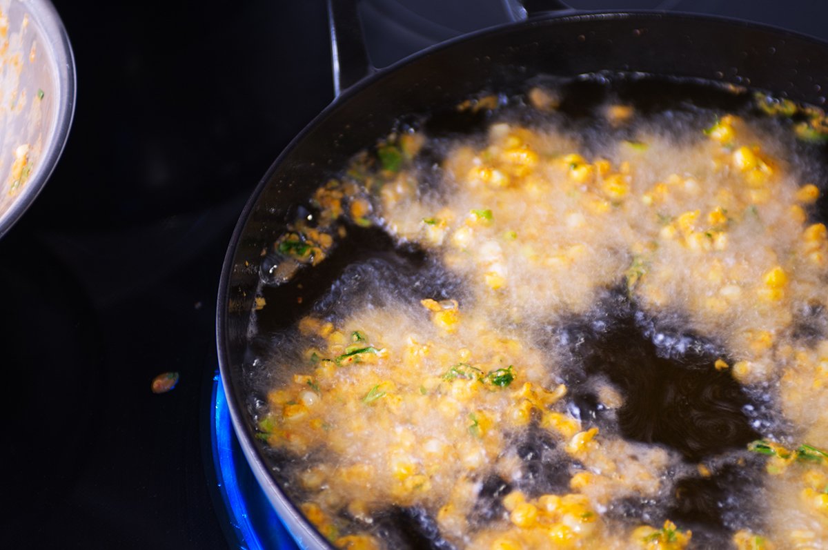 frying the corn fritters