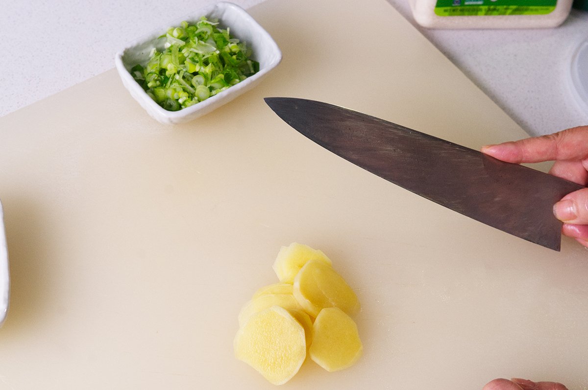 slicing ginger for miso mussels