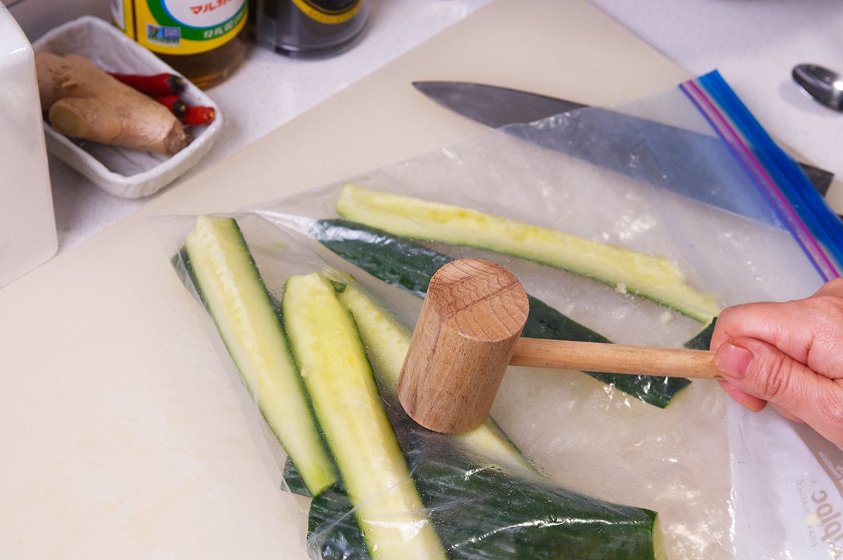 smashing cukes with mallet
