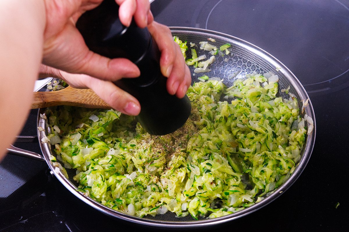grinding black pepper into zucchini jam
