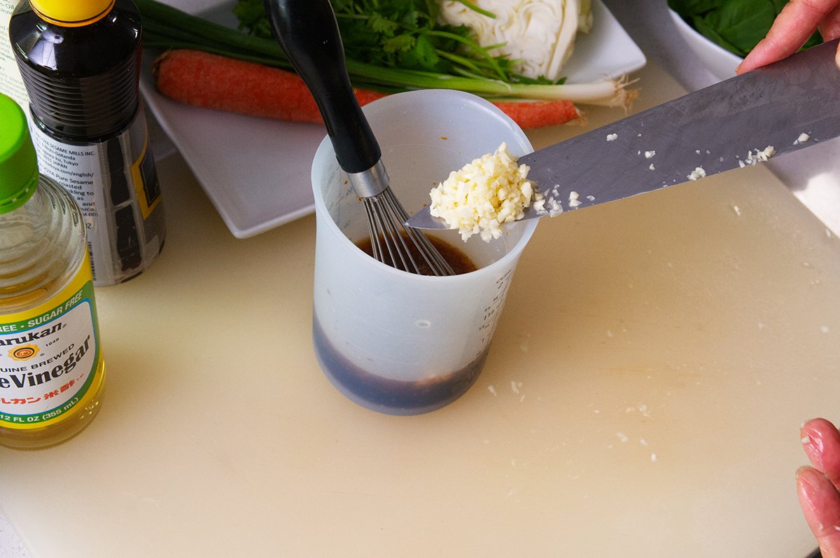 adding garlic to dressing