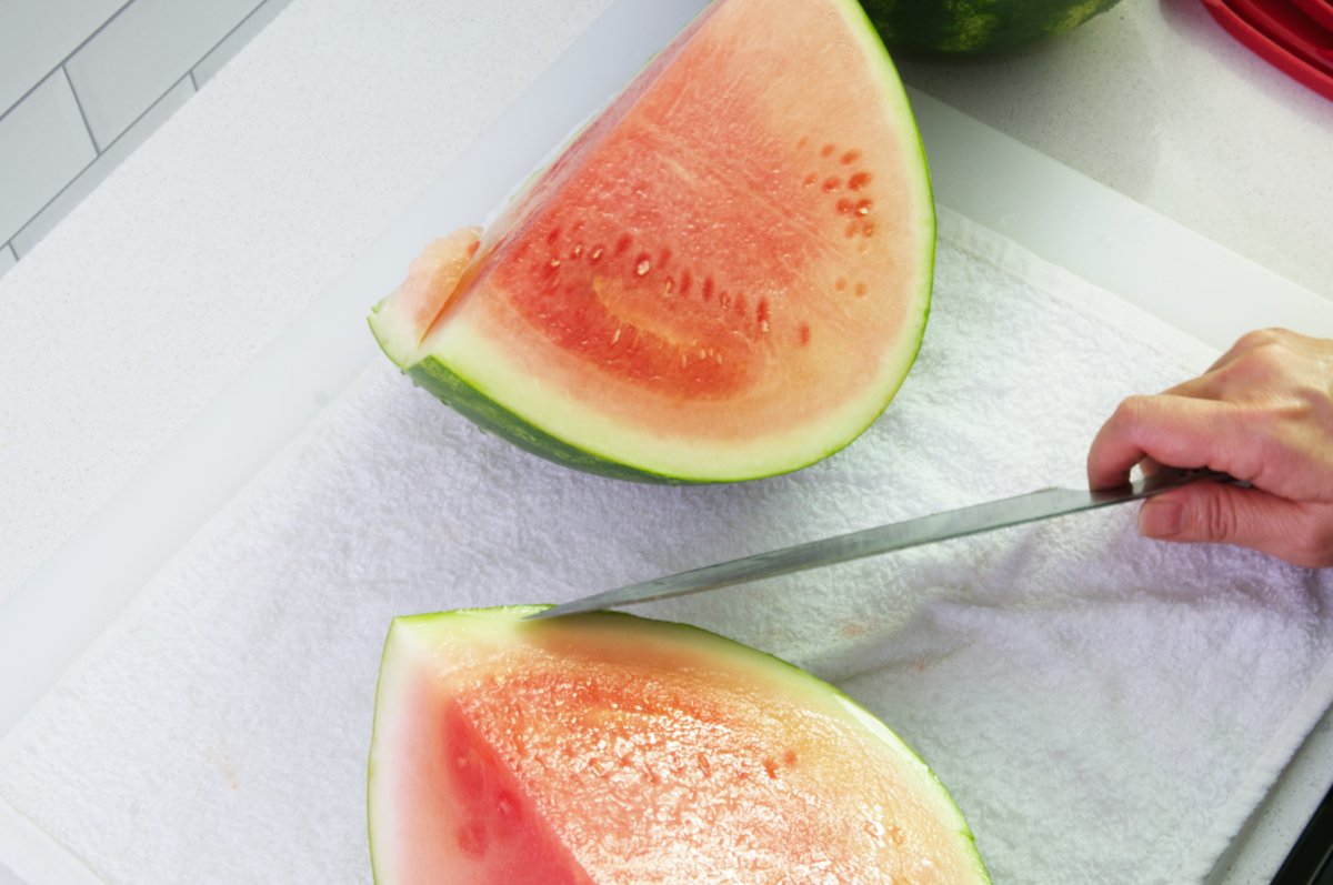 cutting into quarters for watermelon soju