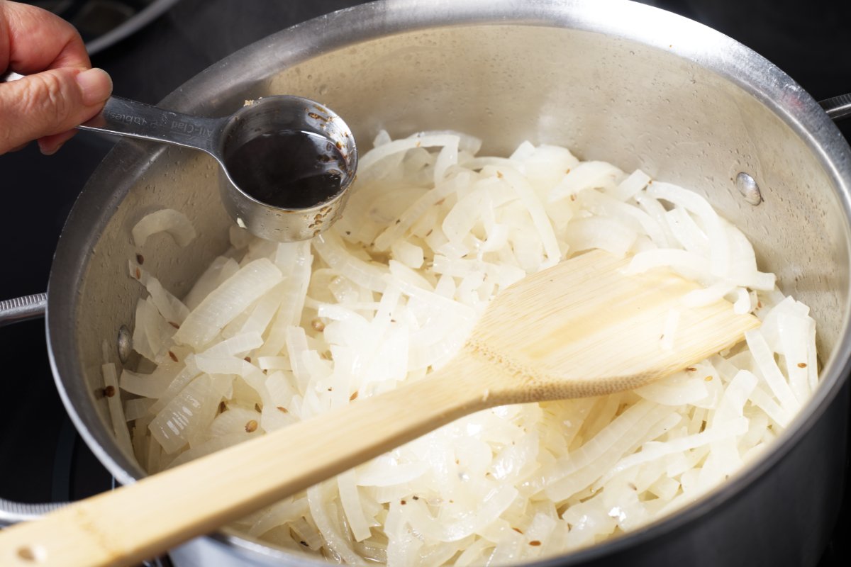 pouring soy sauce on onions
