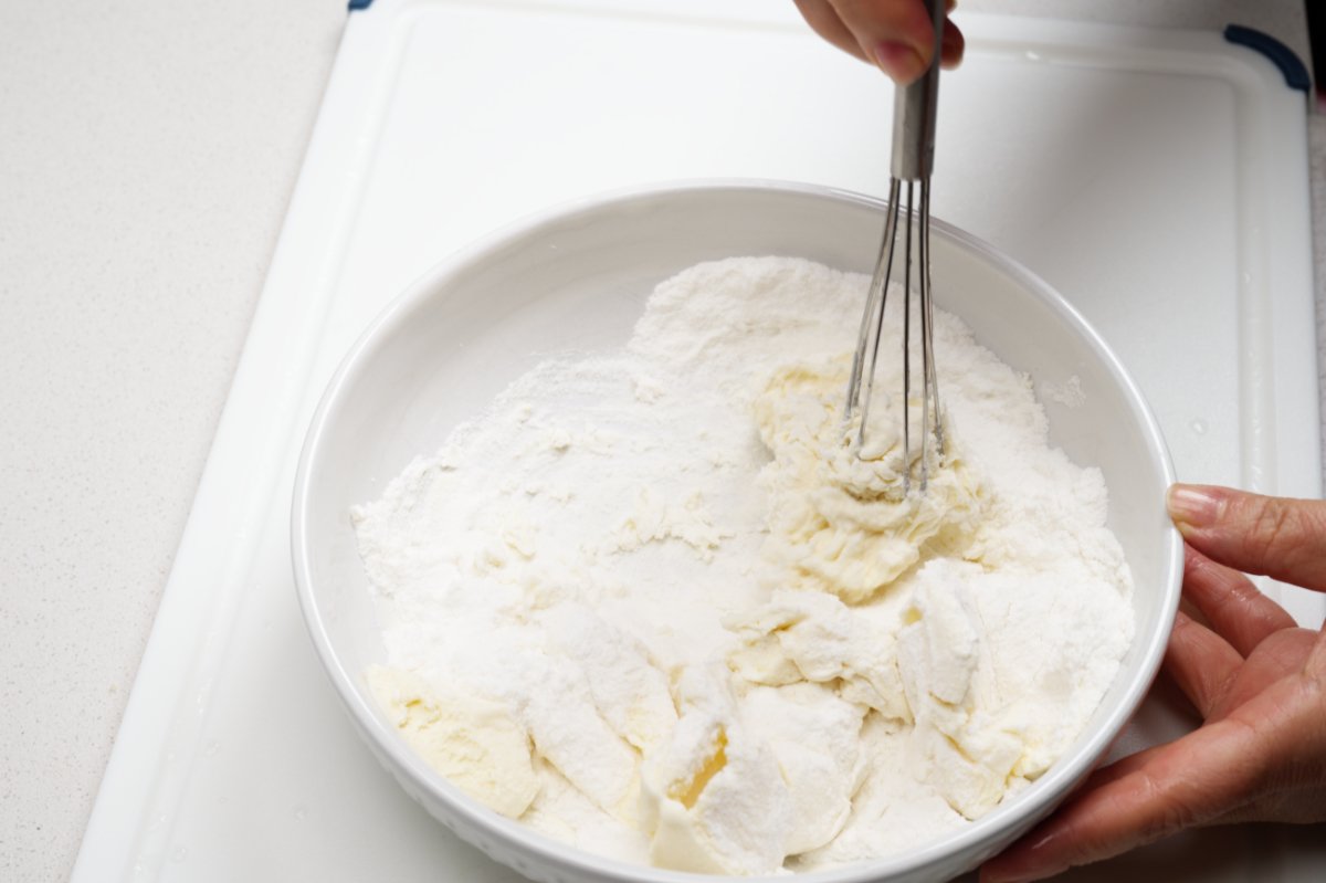 whisking mochi dough