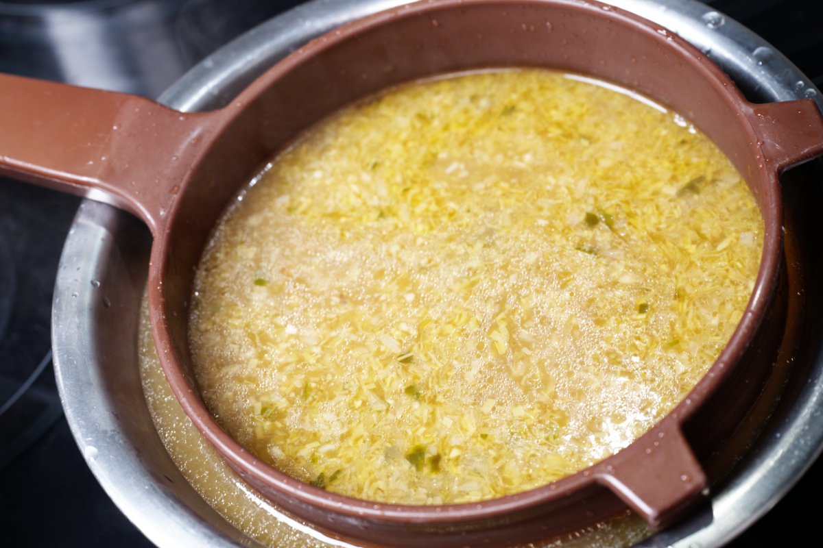 straining solids out of lemongrass shrimp broth