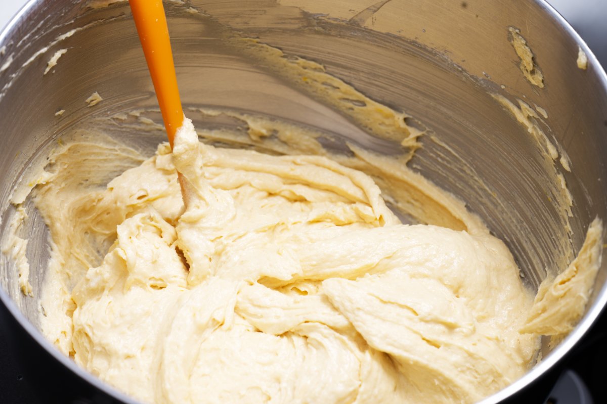 using a spatula to mix pound cake batter