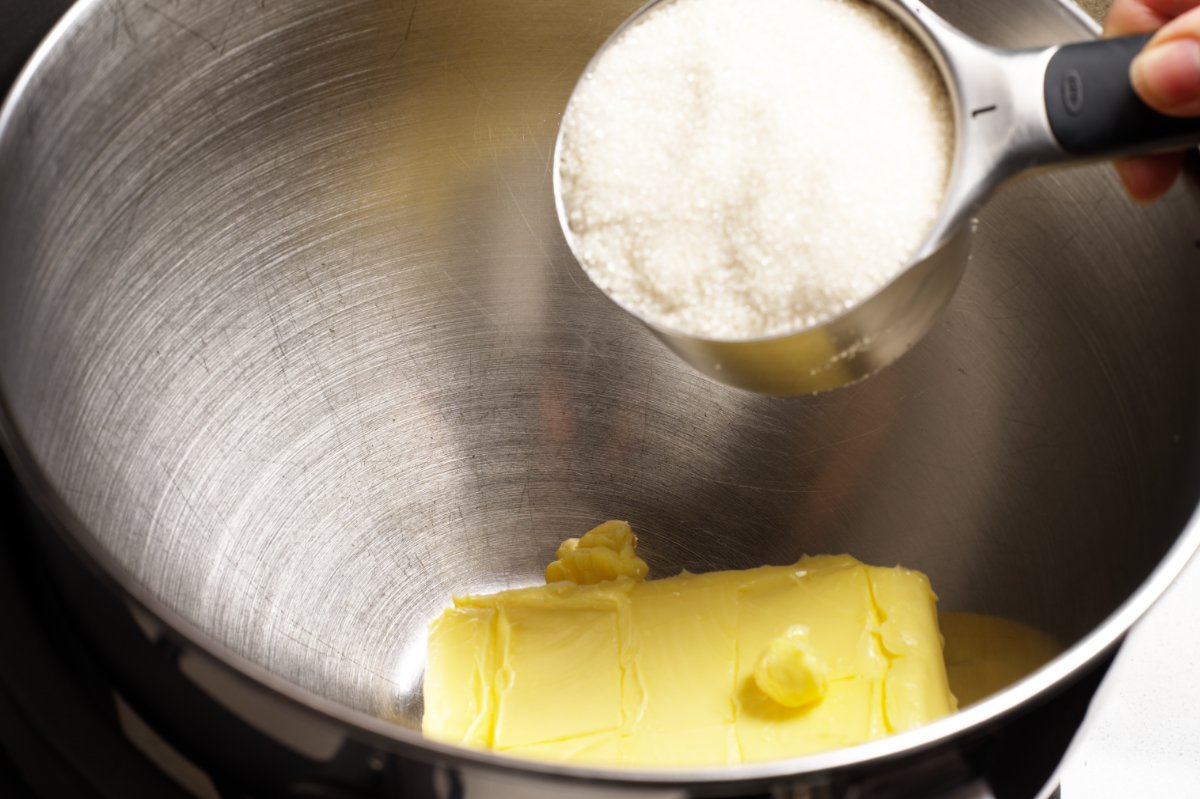 adding sugar to butter