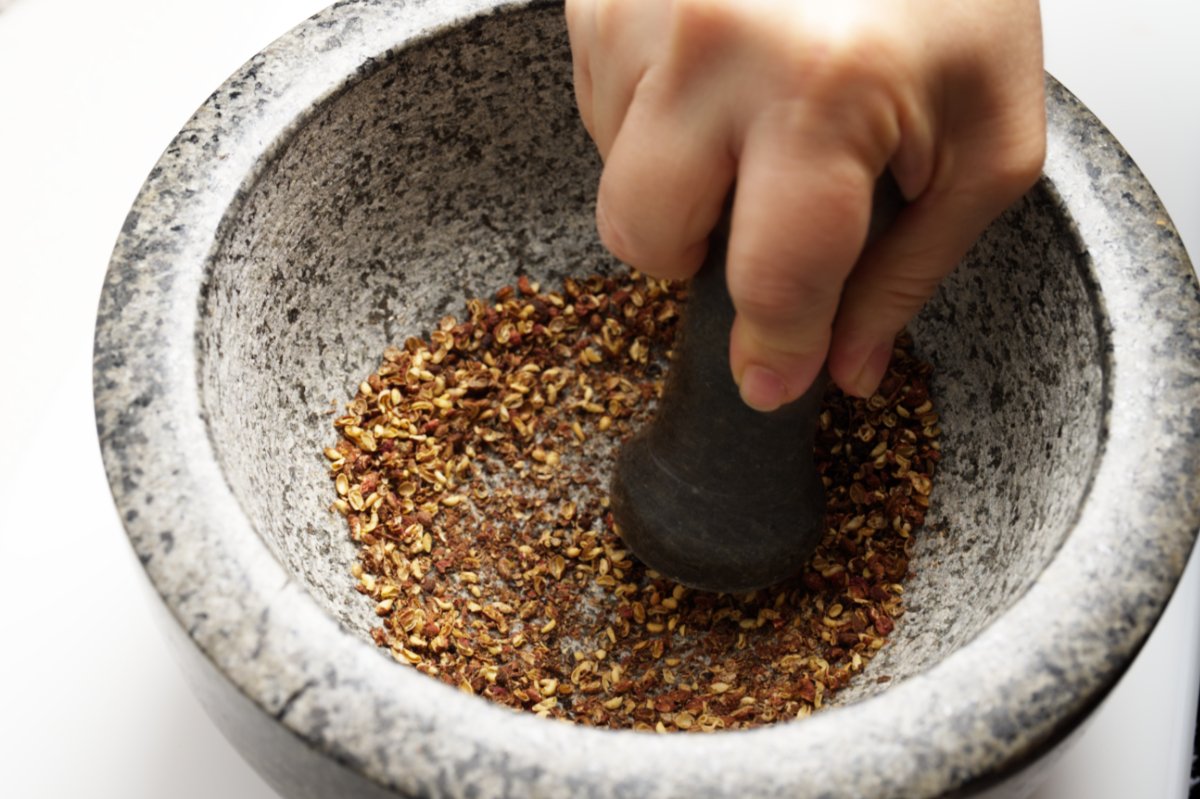 grinding peppercorns