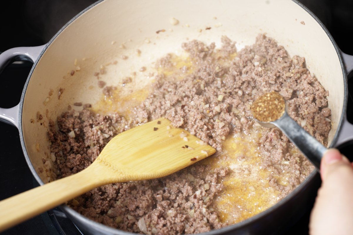 stirring the pepper into the mapo tofu