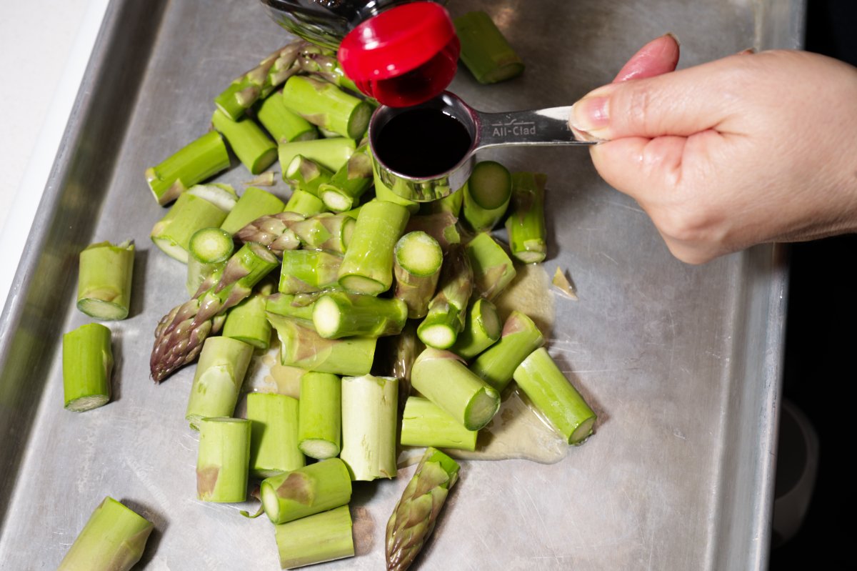 pouring soy sauce on top