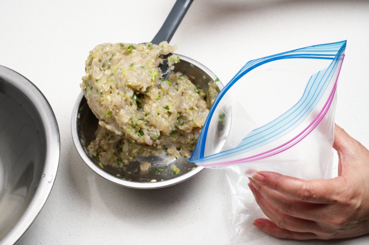 adding filling to bag