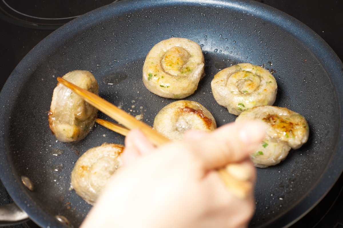 flipping shrimp dumplings