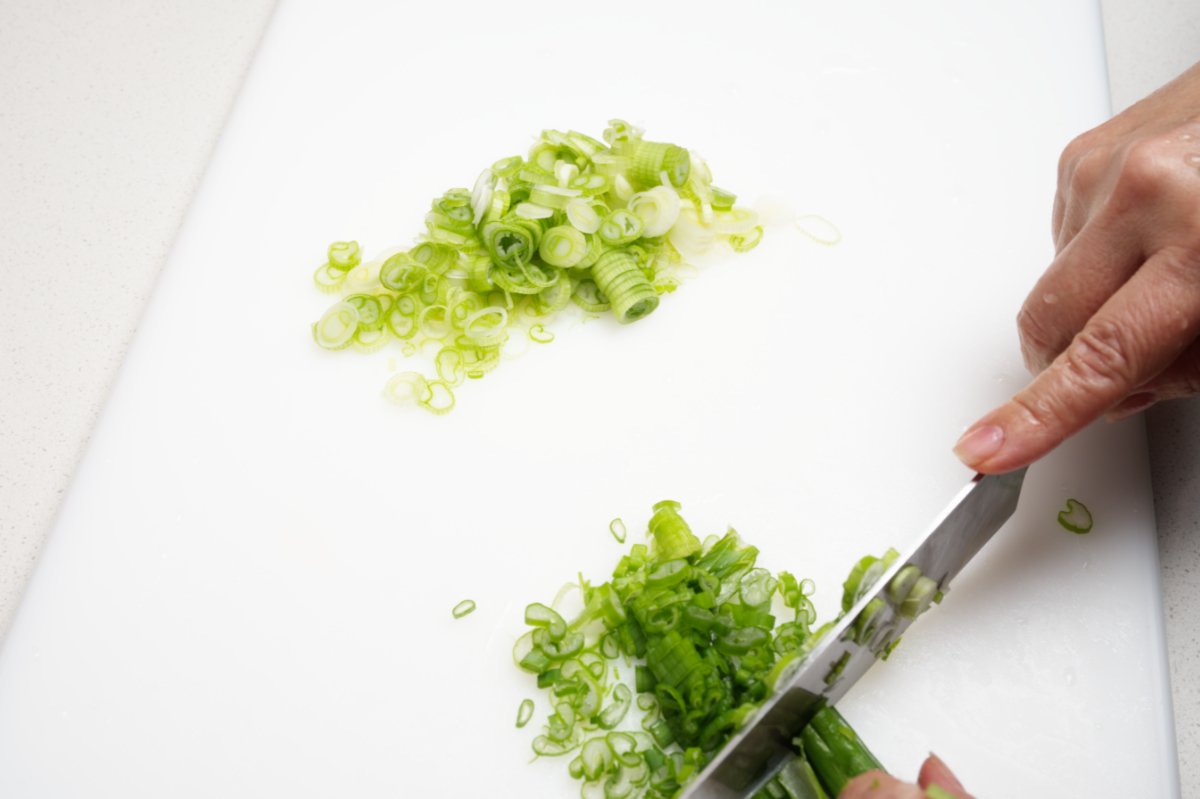 trimming scallions for caramelized beef fried rice