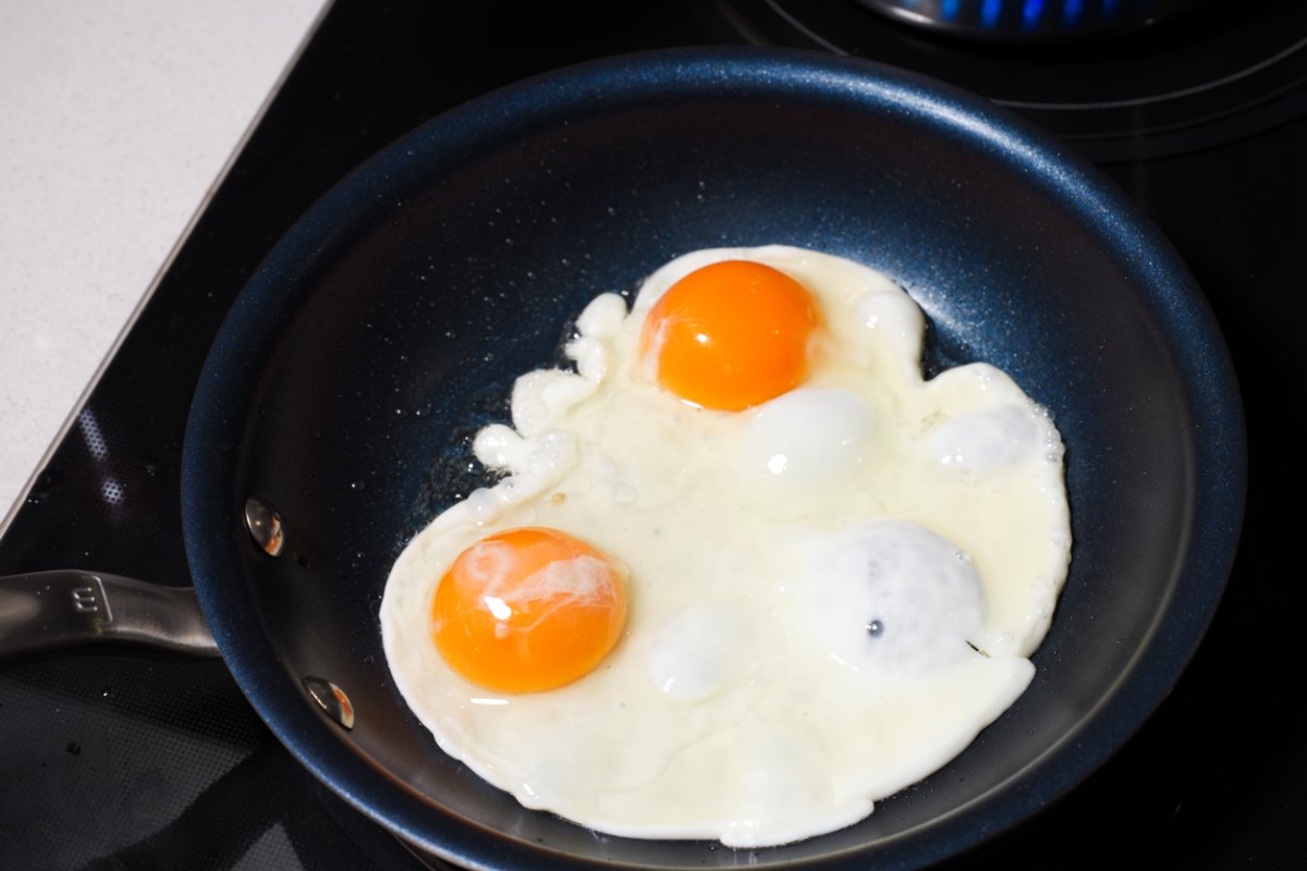 frying the eggs for tarako fried rice