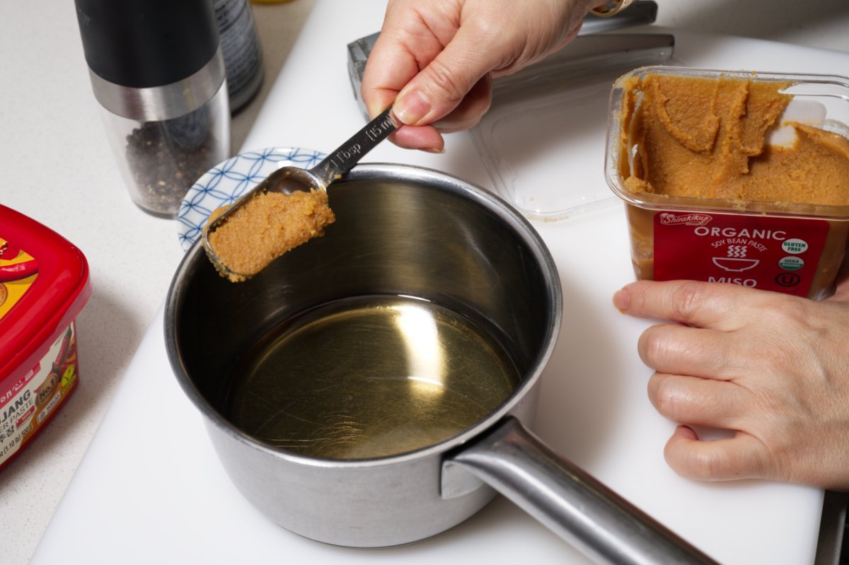 adding miso to chilled tofu terrine sauce