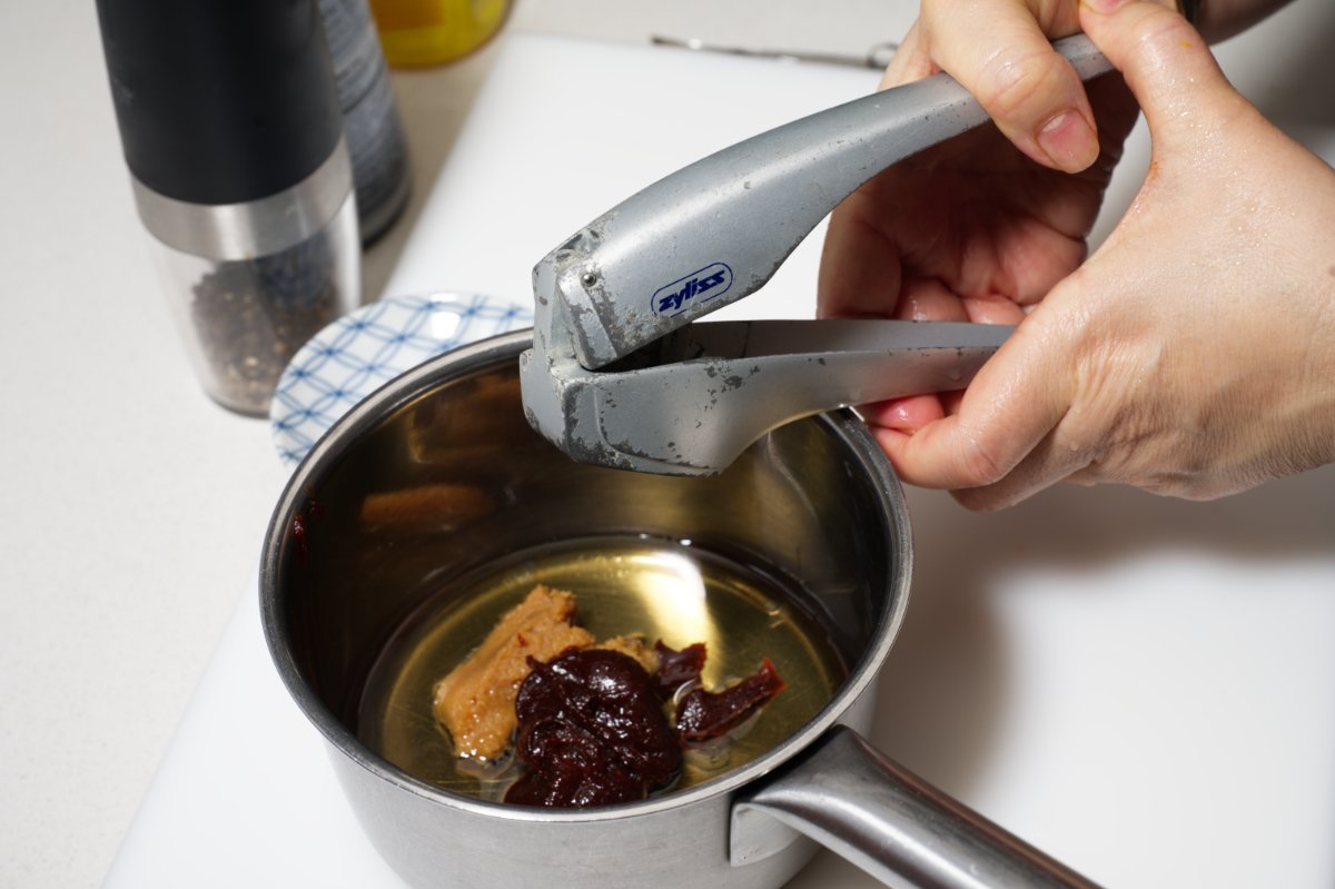 mincing garlic into chilled tofu terrine sauce