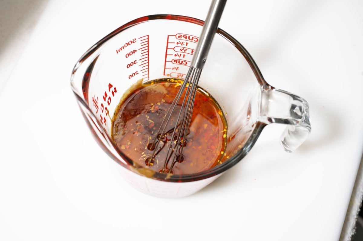 whisking dan dan noodles sauce together