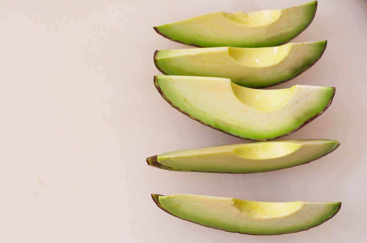 prepping avocado for california rolls