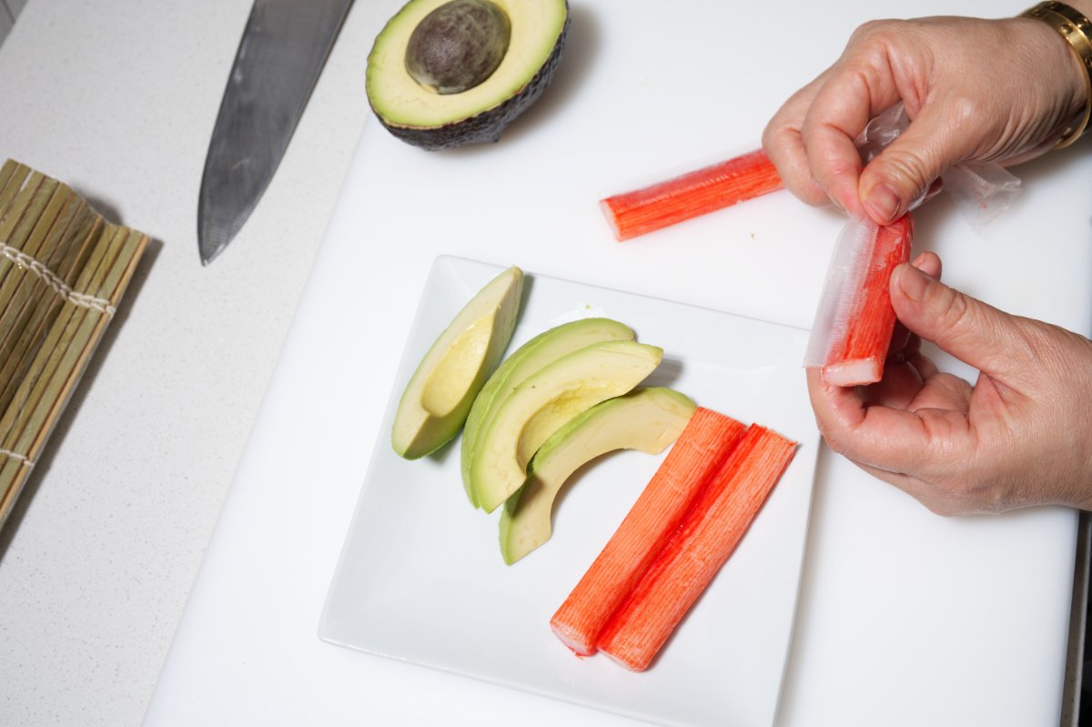 unwrapping krab sticks for california rolls