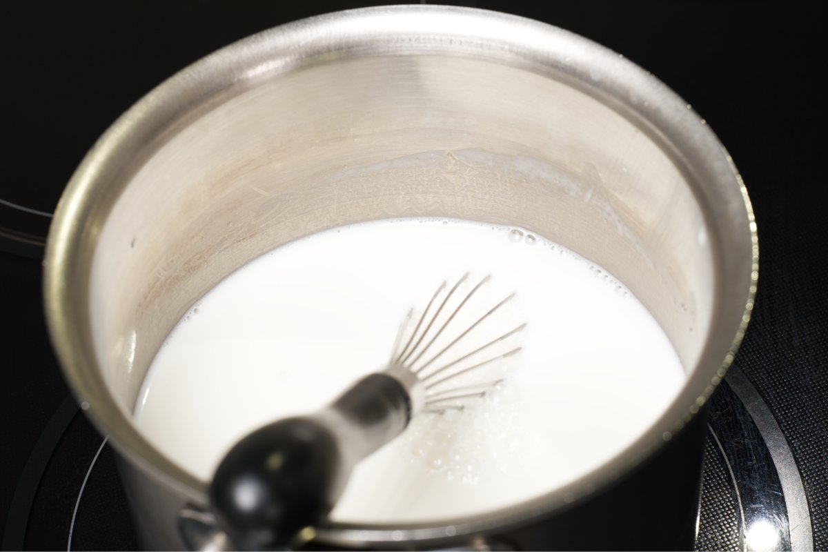 pic of heating milks to a simmer for coconut tapioca