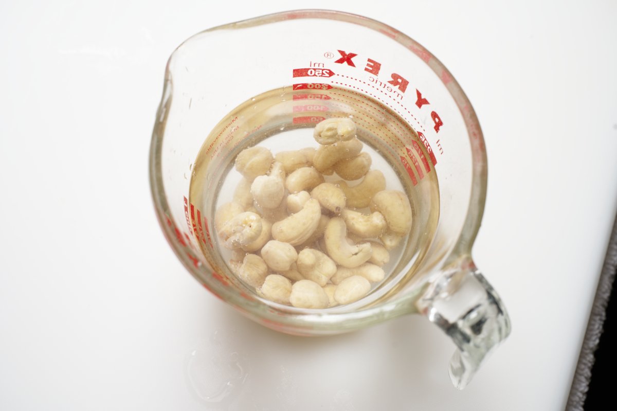 soaking cashews for chilled shrimp with asian pesto