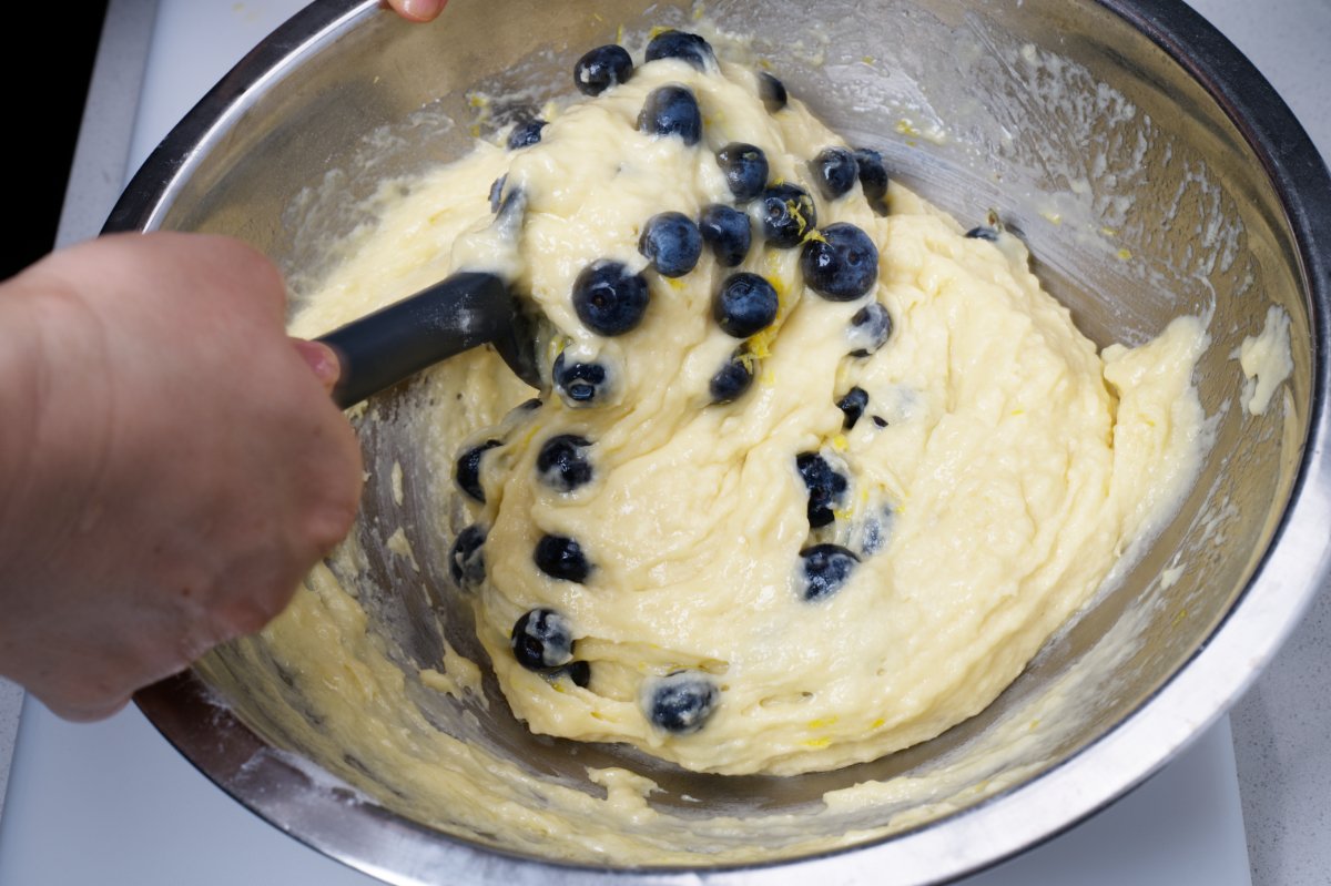 mixing in blueberries