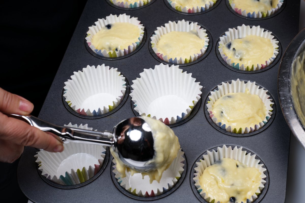 portioning muffin batter