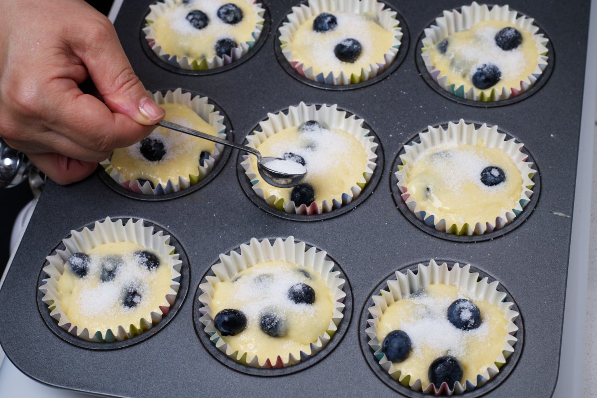 sugar on top of blueberry muffins