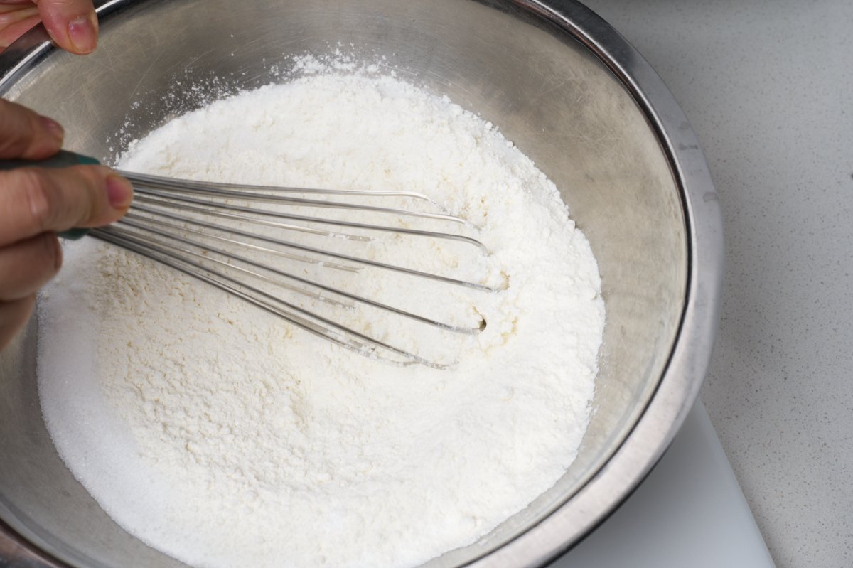 whisking dry ingredients for blueberry muffins