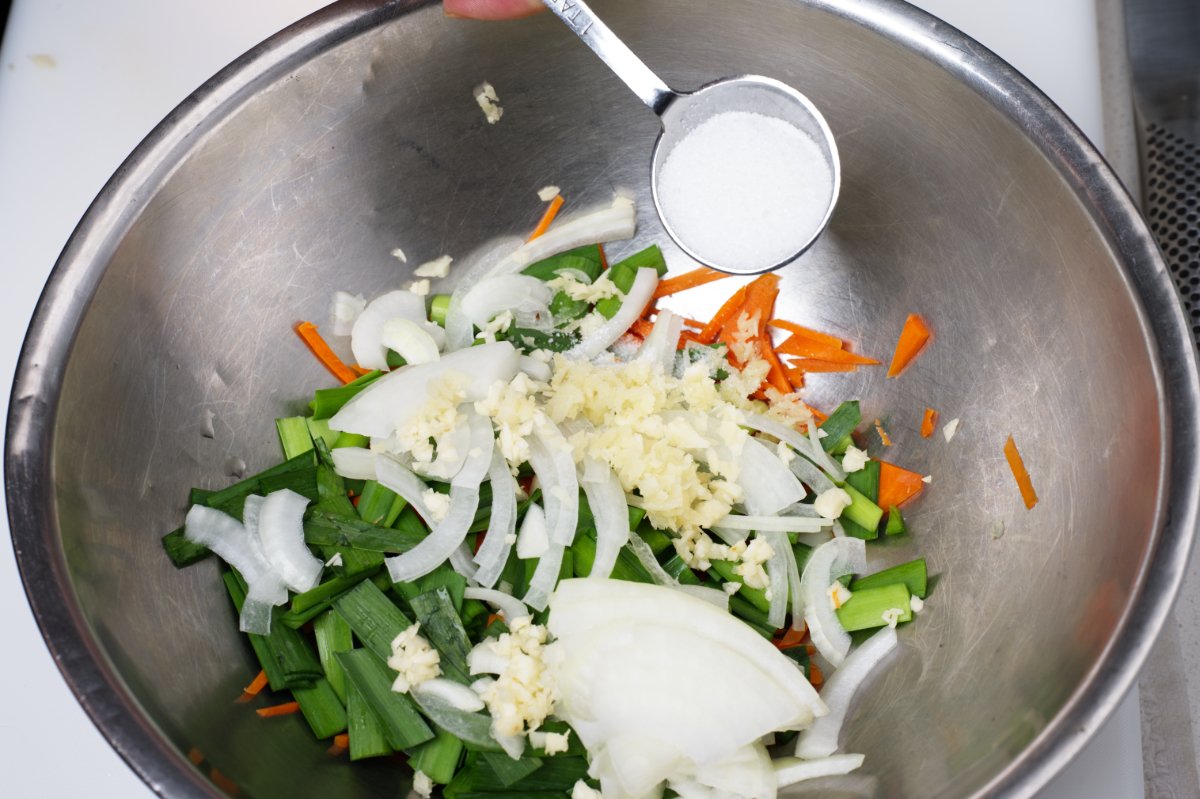 adding dugar to stuffed cucumber kimchi