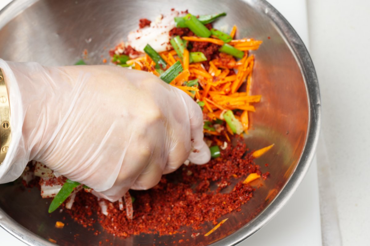 mixing stuffed cucumber kimchi filling