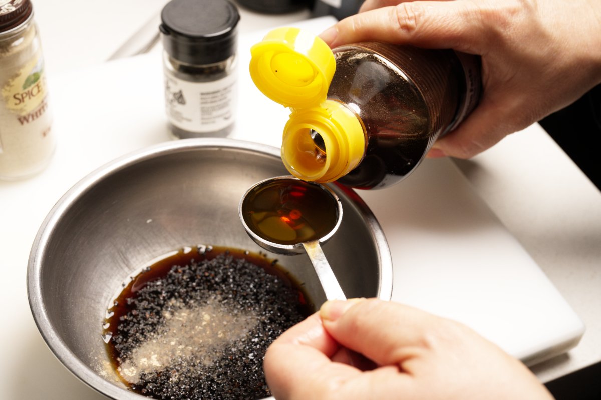pouring sesame oil for Chinese-style eggplant salad
