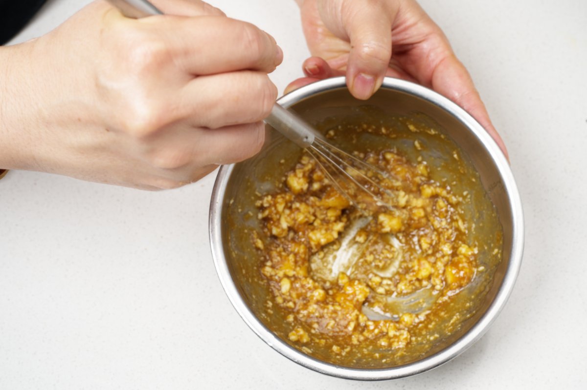 mixing miso butter for slow roasted okinawan potatoes