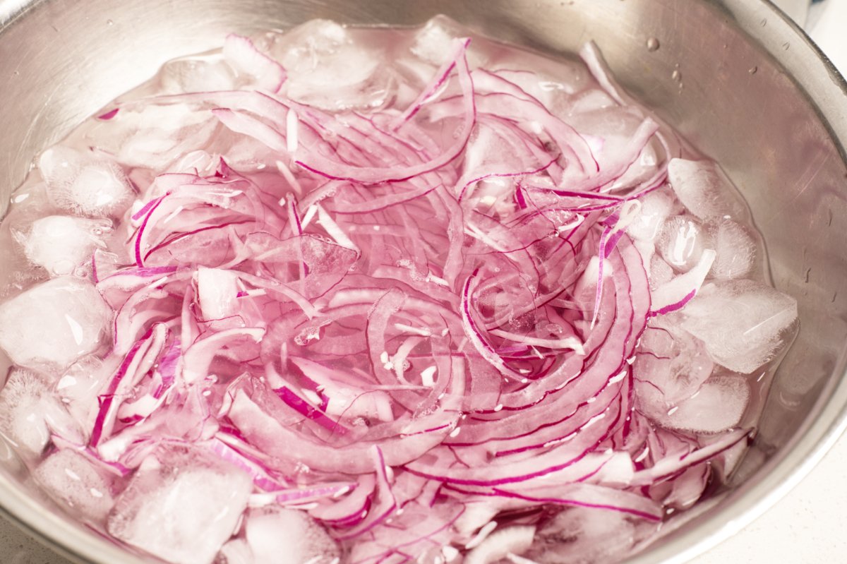 soaking onions for kale caesar salad