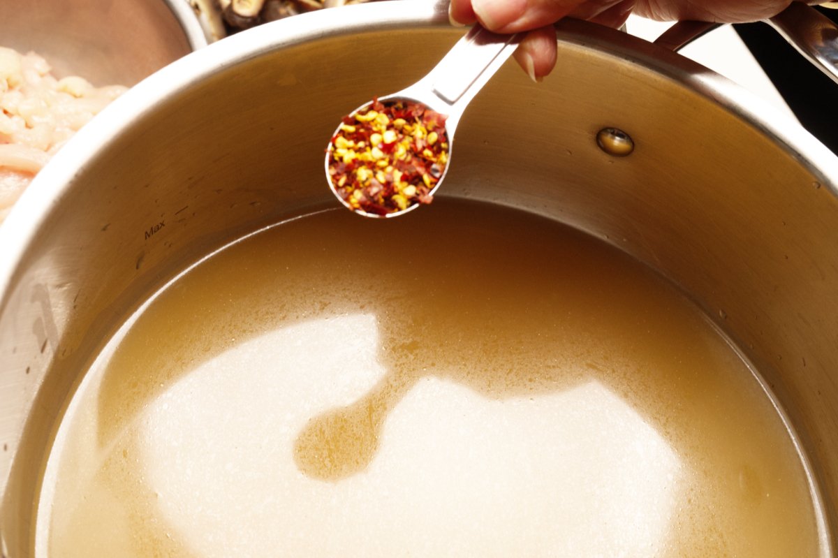 adding chili flakes to stock