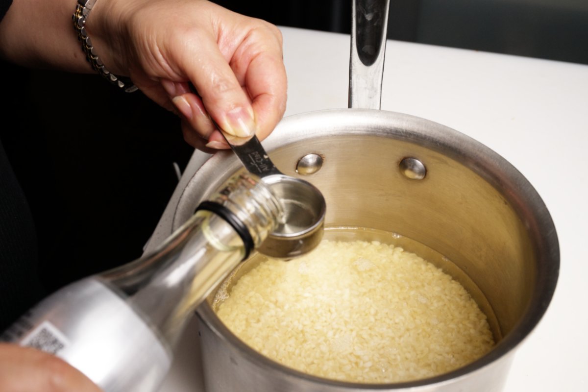 adding sake to matsutake rice 