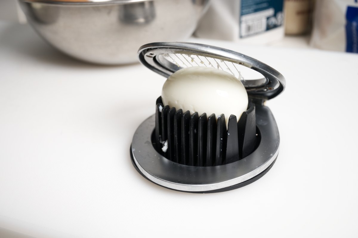 using slicer to cut eggs for japanese egg sandwich