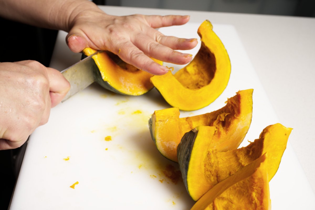 cutting kabocha into wedges