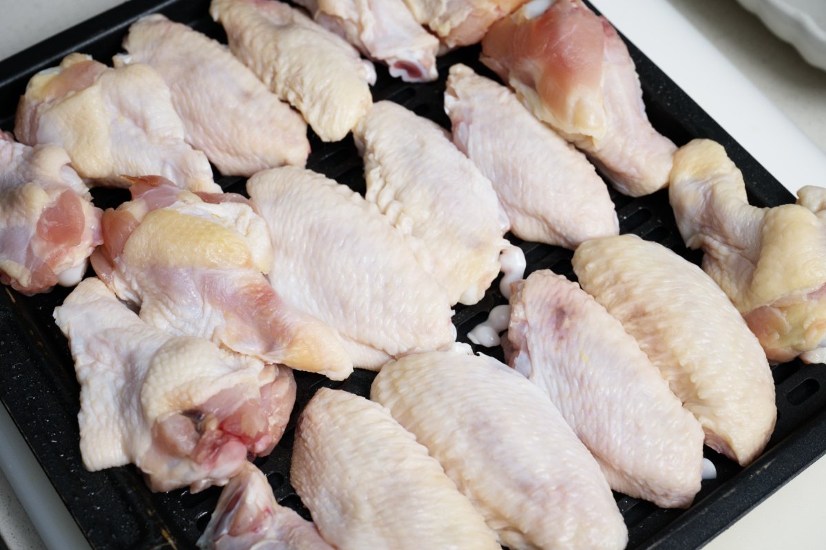 lay wings flat on baking sheet