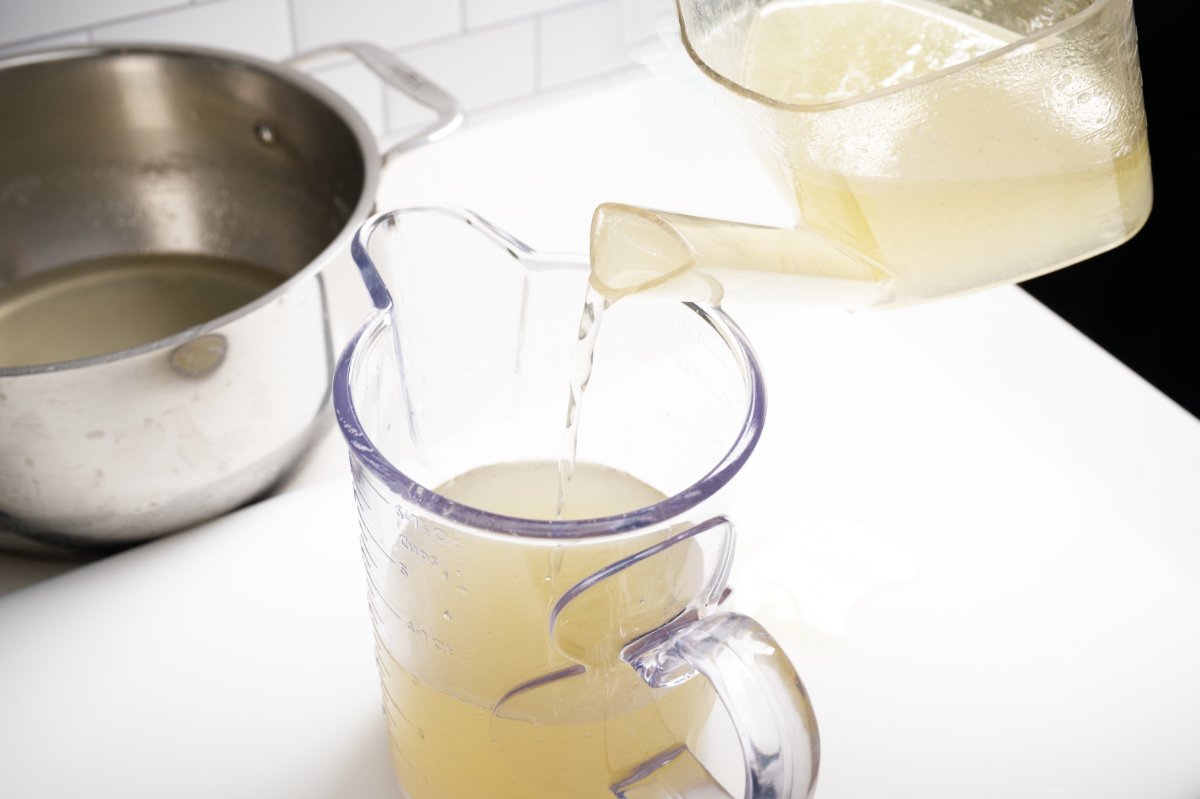 pouring stock into fat separator taiwanese turkey rice