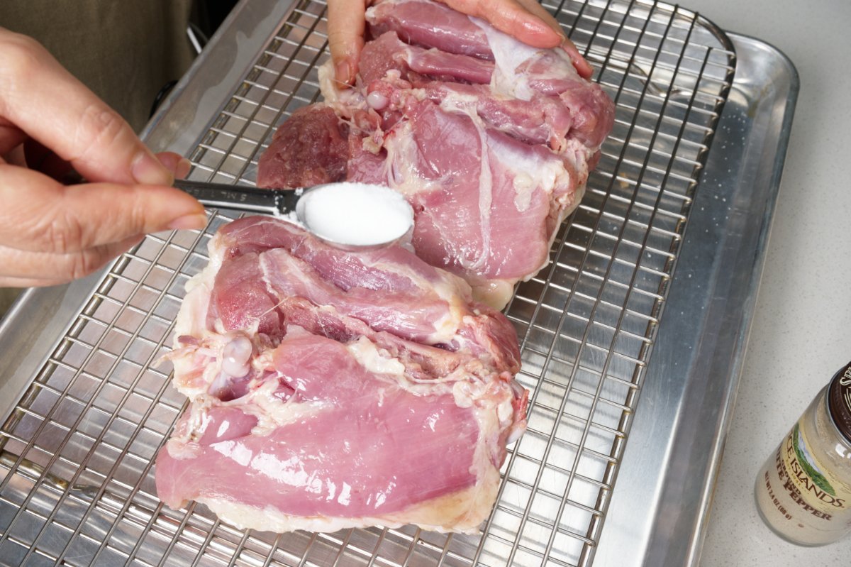 sprinkling dry brine on turkey thighs