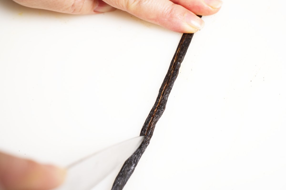 slicing vanilla bean lengthwise for homemade extract
