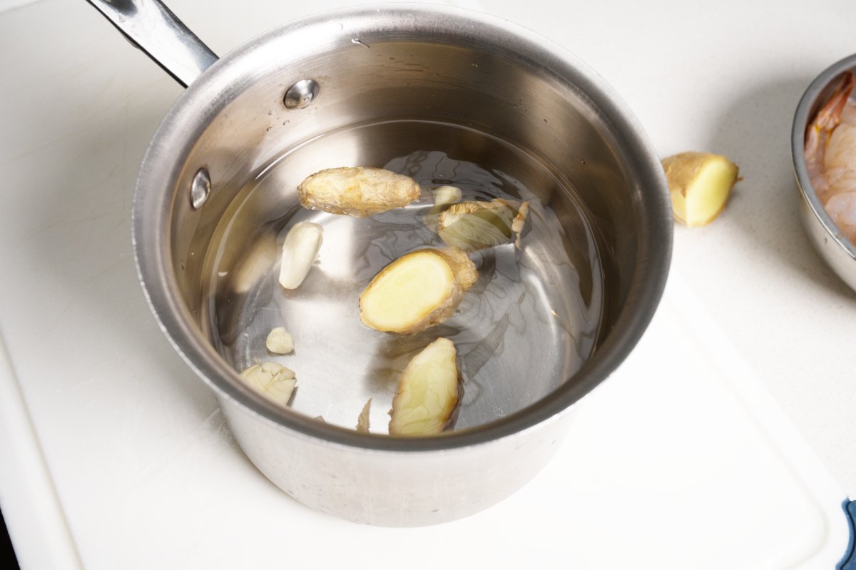 making the poaching water for shrimp and celery salad