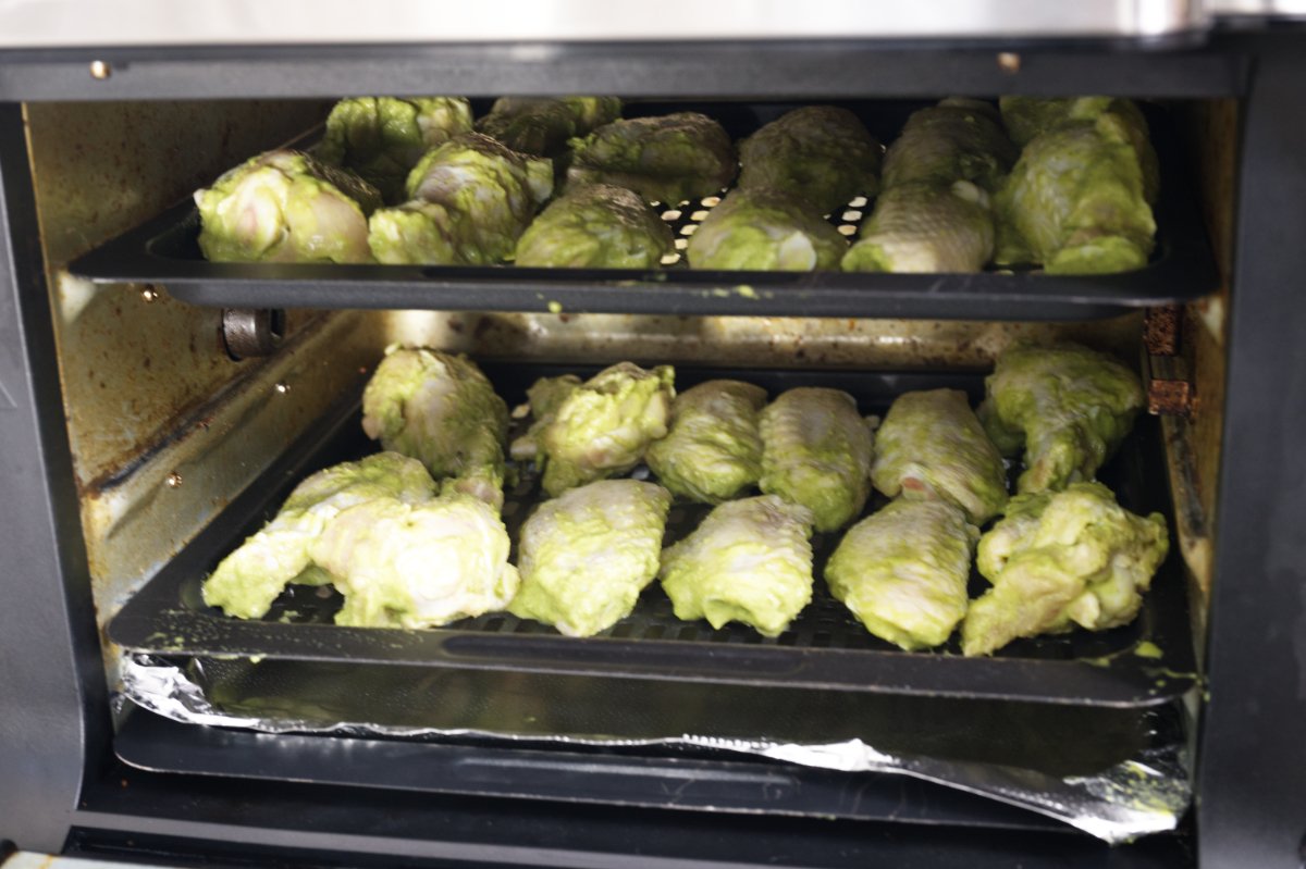 photo of green curry wings in the oven